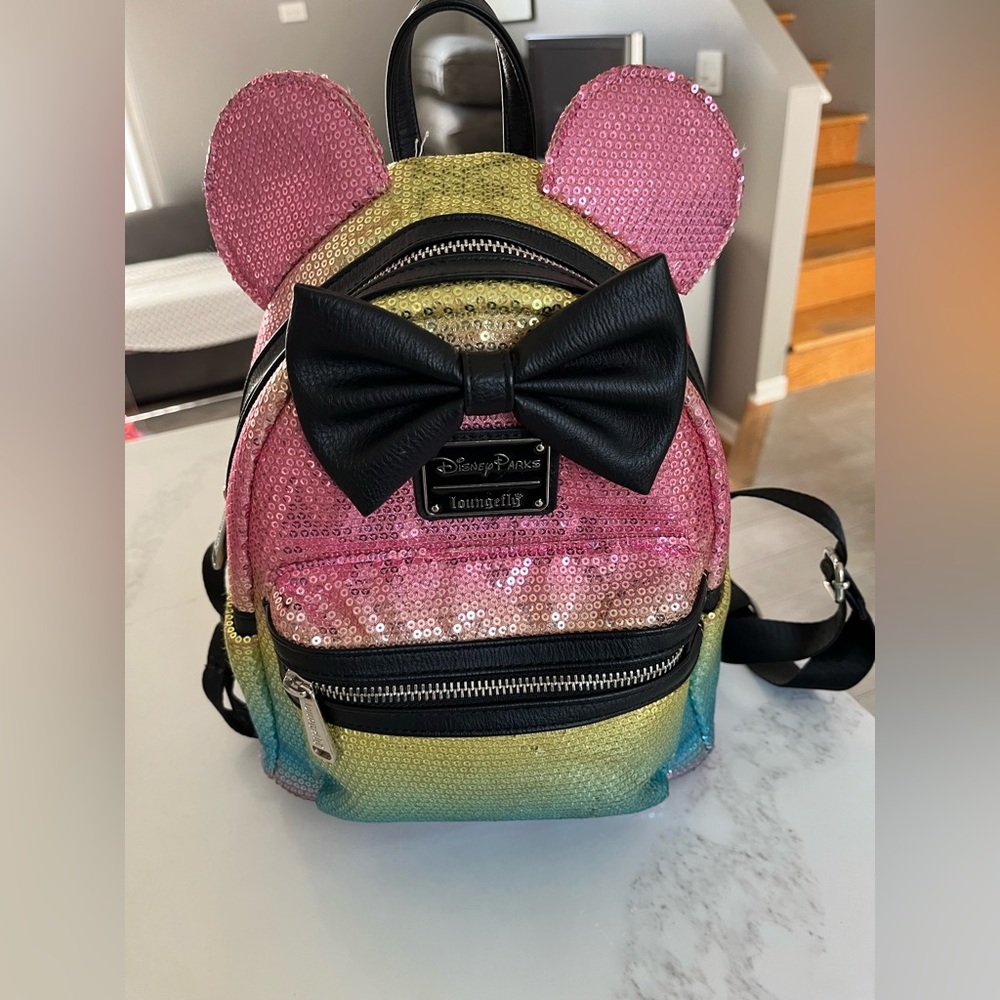 2020 loungefly Disney parks mini mouse rainbow sequined backpack.  Black bow!